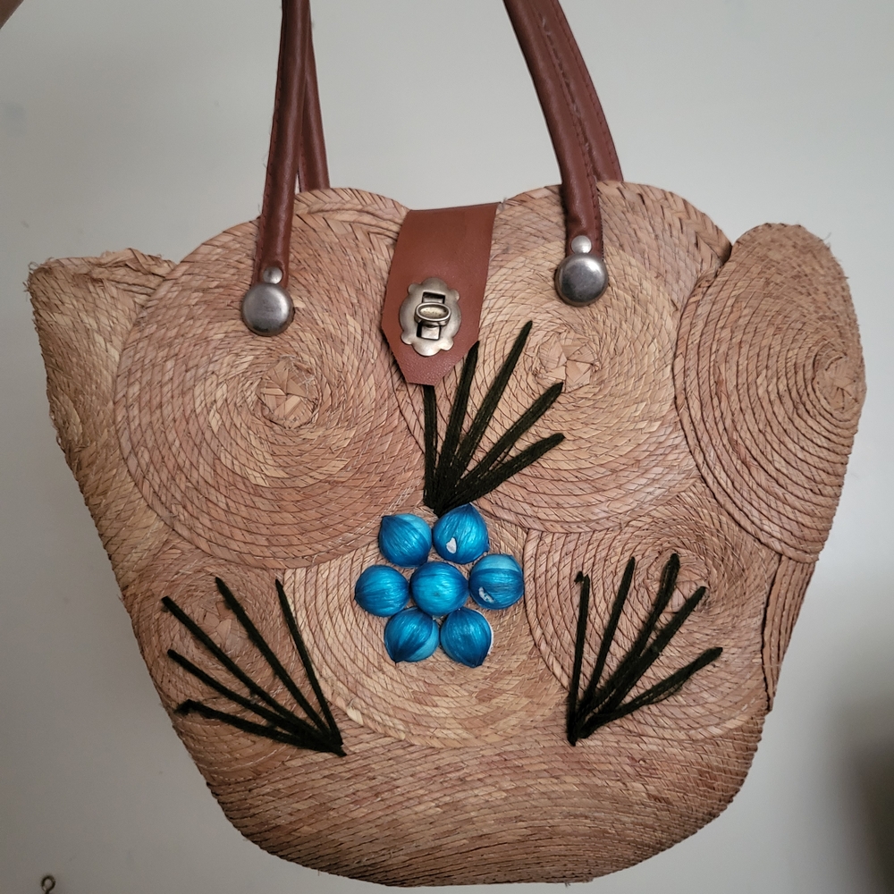 Handcrafted Straw Tote Bag with Blue Floral Accent